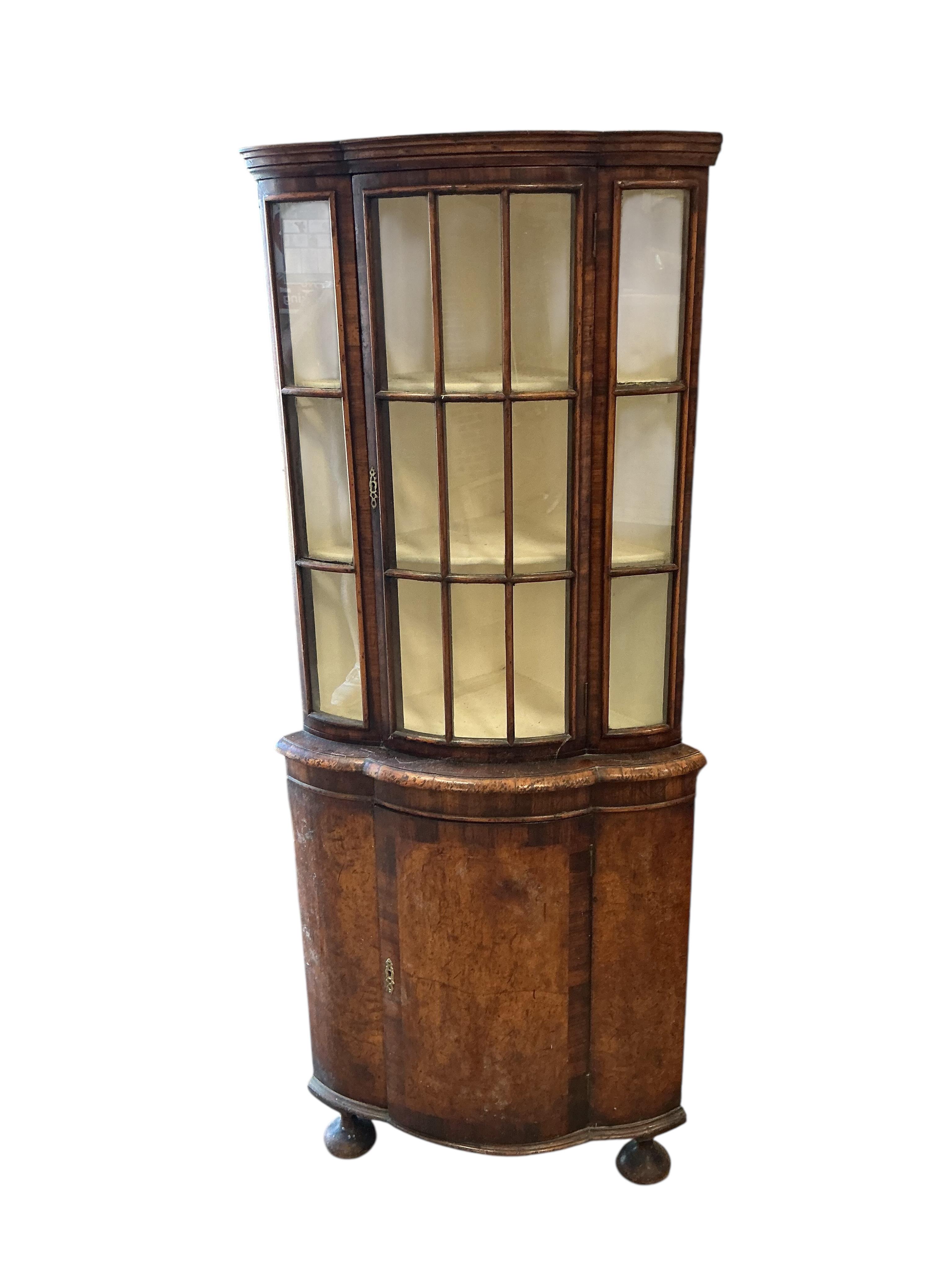 A Queen Anne Revival walnut bow front standing corner cupboard, width 68cm, depth 43cm, height 160cm
